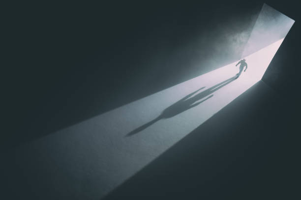 istock Walking Through The Doorway Into Darkness 1338220776
