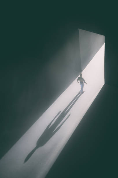 istock Walking Through The Doorway Into Darkness 1338220794