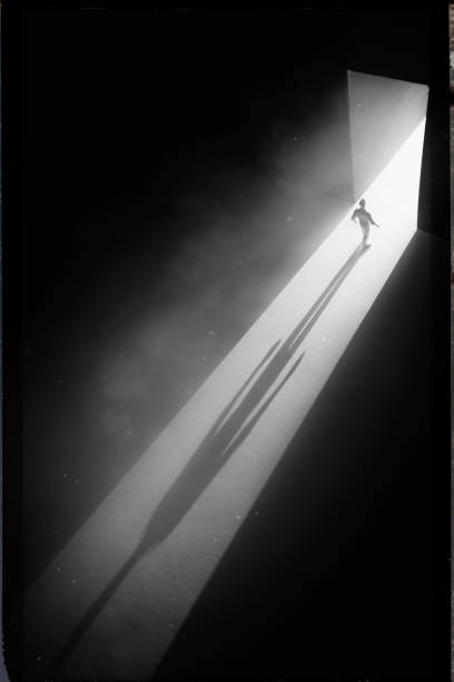 istock Walking Through The Doorway Into Darkness 1338220795