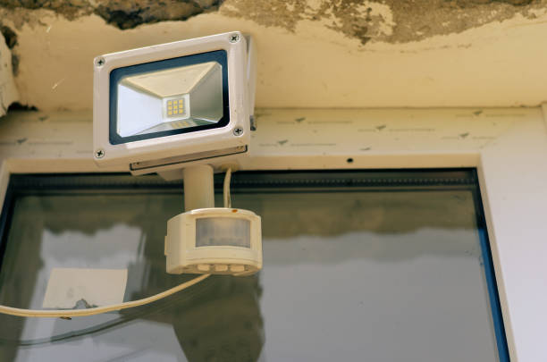 istock Motion sensor and LED spotlight on the wall of the building. Aut 1338221842