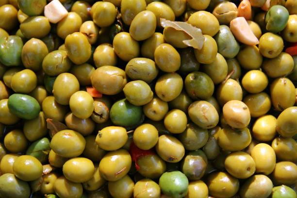 istock olives in pickling brine background texture 1338222178