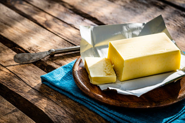 istock Butter stick on wooden table. Copy space 1338222221
