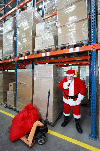istock thinking santa claus in storehouse 133822395