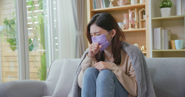 istock asian woman cough at home 1338224815