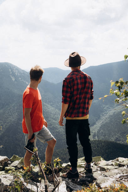 istock Two men are looking at the scenic view in mountains 1338227952