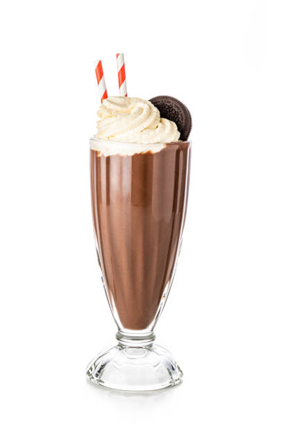 Chocolate milkshake isolated on white background Front view of a chocolate milkshake with whipped cream and a chocolate cookie isolated on white background chocolate shake stock pictures, royalty-free photos & images