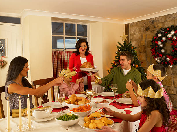 Hispanic family having Christmas dinner together at home