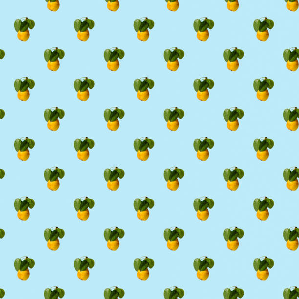 Ripe juicy yellow pears with green leaves on a colored background. Seamless patterns.