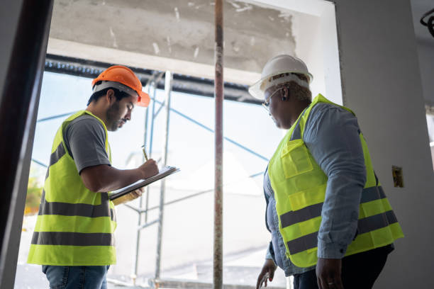 istock Coworkers doing a meeting in a construction site 1338237669