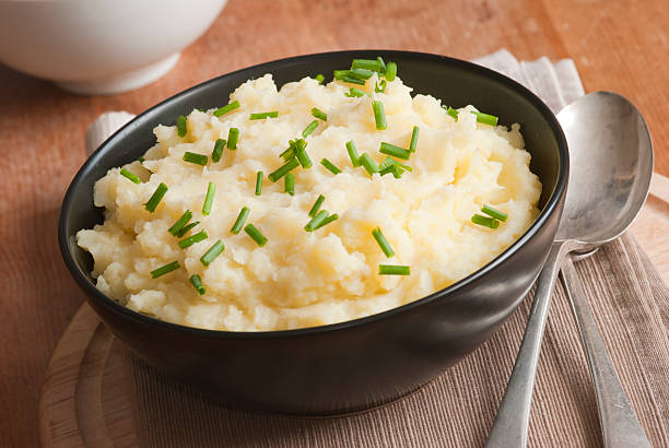 istock Table setting of a black bowl of smashed potatoes 133823978