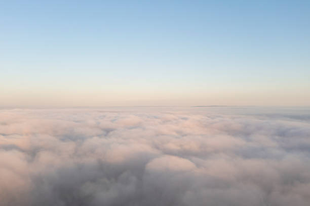 istock Aerial view white clouds in blue sky. View from drone. Aerial top view cloudscape. Texture of clouds. View from above. Panorama clouds 1338241952