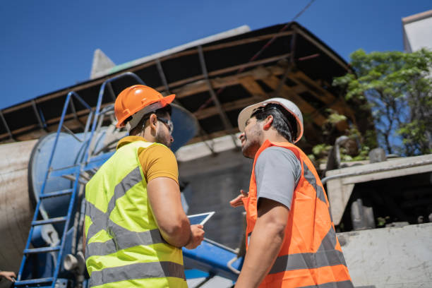 istock Rear view of coworkers doing a meeting in a construction site 1338243645