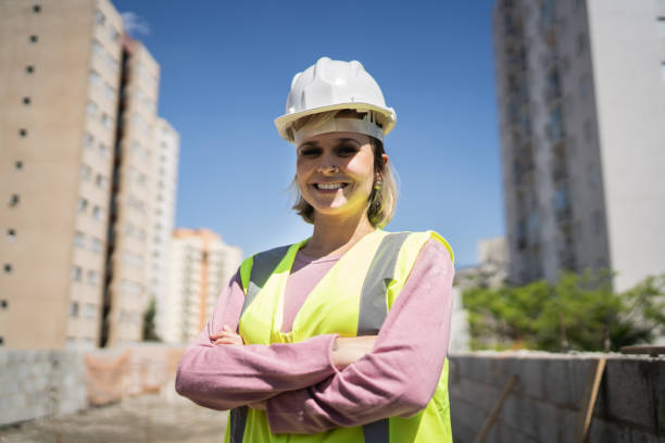istock Portrait of a happy construction worker at a construction site 1338244769