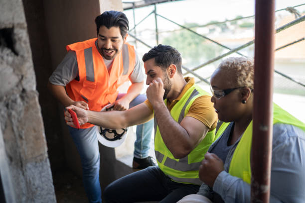 istock Construction workers watching sports match on smartphone in a construction site 1338244855
