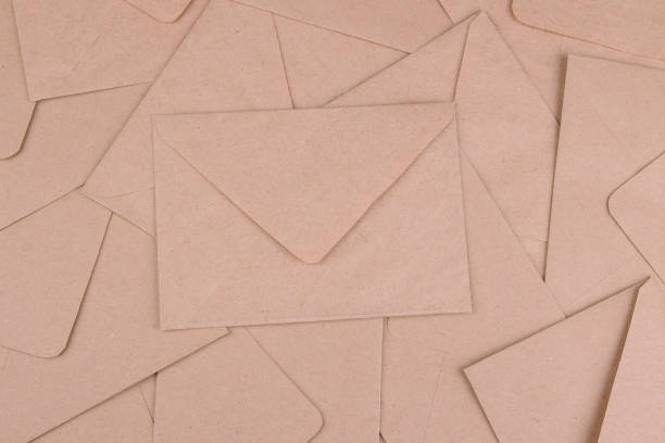 istock Background from mail envelopes from craft paper. view from above. mail or delivery concept 1338246293