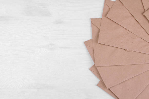 istock Kraft paper envelopes with space for inscriptions. view from above. mail or delivery concept 1338246296