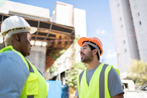 istock Coworkers doing a meeting in a construction site 1338247140
