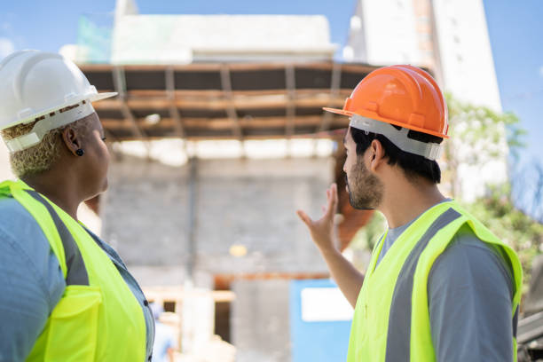 istock Coworkers doing a meeting in a construction site 1338247168