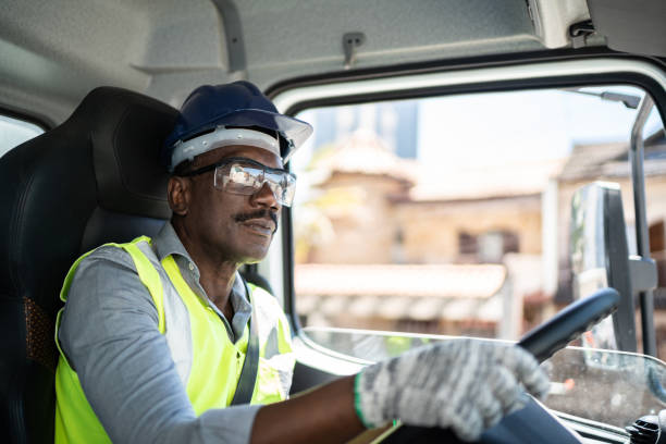 istock Truck driver inside the truck at a construction site 1338247278