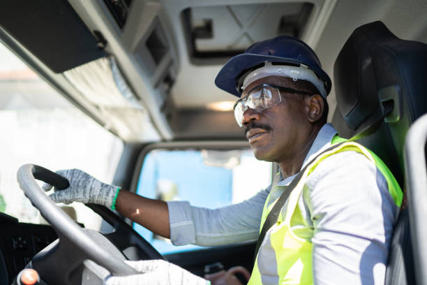 istock Truck driver inside the truck at a construction site 1338247287