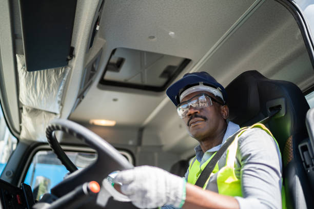 istock Truck driver inside the truck at a construction site 1338247290
