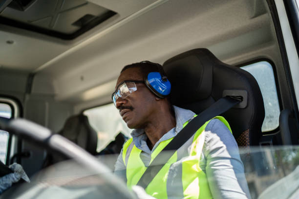 istock Trucker driver inside the truck at a construction site 1338247353