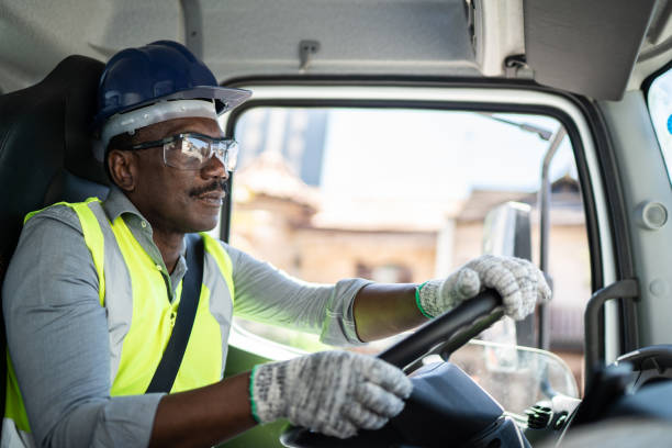 istock Truck driver inside the truck at a construction site 1338247418