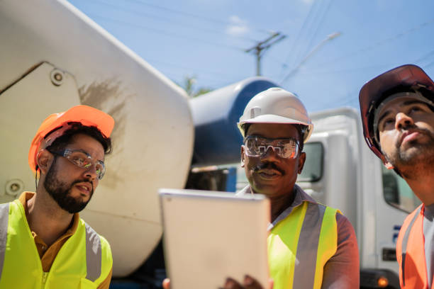 istock Coworkers doing a meeting in a construction site 1338247438