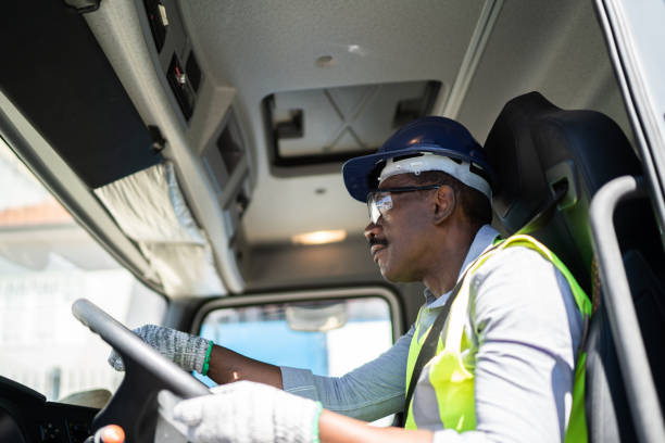 istock Truck driver inside the truck at a construction site 1338247444