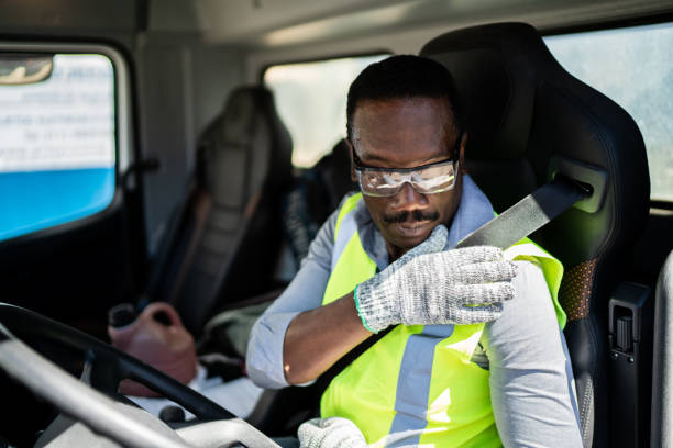 istock Trucker driver inside the truck at a construction site 1338247445