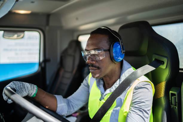 istock Trucker driver inside the truck at a construction site 1338247501