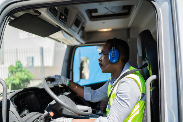 istock Trucker driver inside the truck at a construction site 1338247503