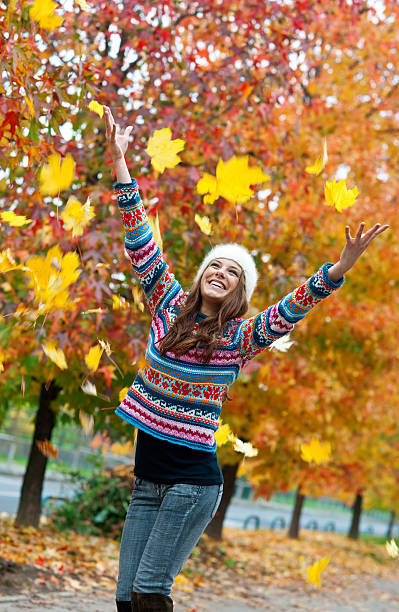 happy young teen girl in autumn scenery stock photo