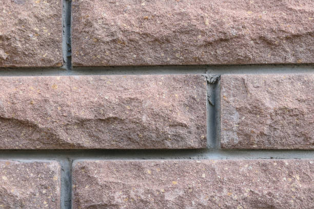 istock Brown background of beautiful building brick 1338253579