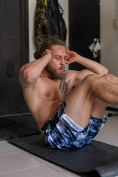 istock Man trains at home while alone and isolated by COVID 19 1338256527
