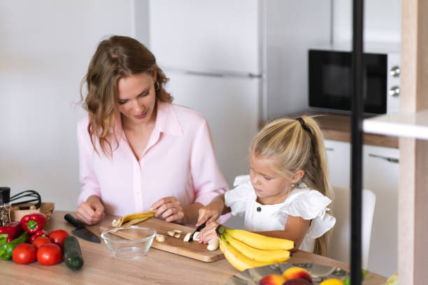 istock A mother and daughter in the kitchen 1338257807