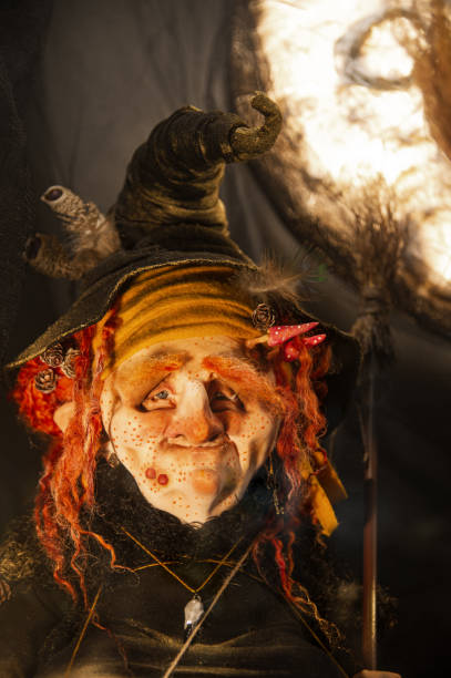 istock Halloween witch with red hair in hat and rags 1338258951