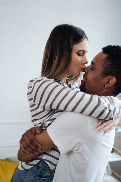 istock Mixed race couple dancing at home 1338264297