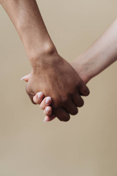 istock Young diverse couple holding hands, agree to bring the plan to life 1338264544