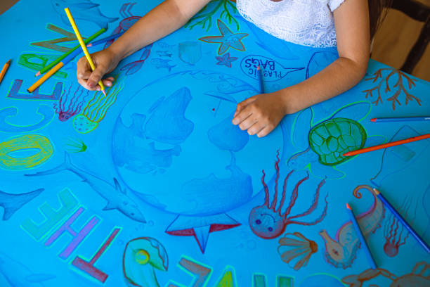 istock Creative and dedicated girl, drawing the poster with a strong message 