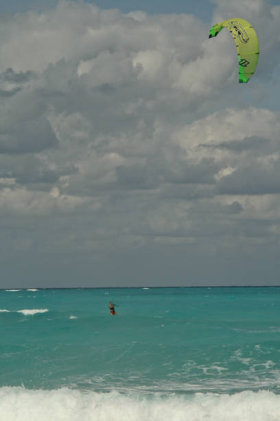 Kite surfing Sol Cayo Santa Maria, Cuba - December 20, 2009: Local resort water sports instructor demonstrating kite surfing techniques. trishz stock pictures, royalty-free photos & images
