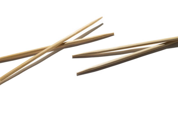istock Chopsticks on white bacground with hard shadow and place for copy space 1338271635