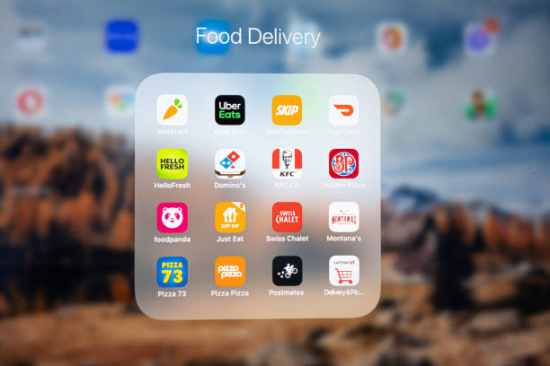 june 3 2021 - calgary alberta canada - food delivery app on an apple ipad - ipad 3 imagens e fotografias de stock