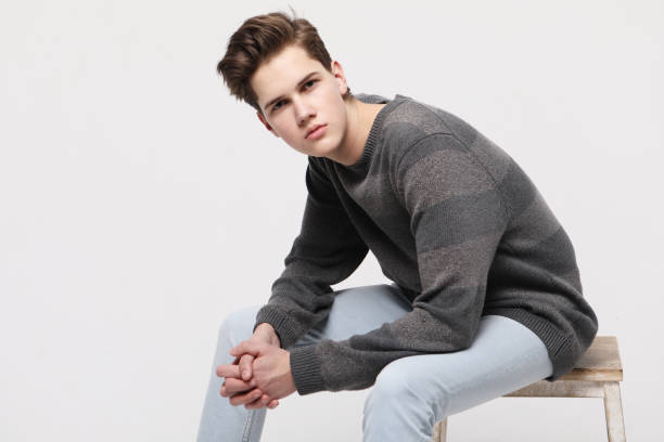 istock Attractive teenage boy posing in studio 1338276625