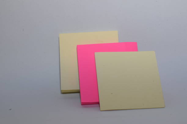 istock Rectangular sticky notepad. Fuchsia pink and yellow colors on white background 1338280170