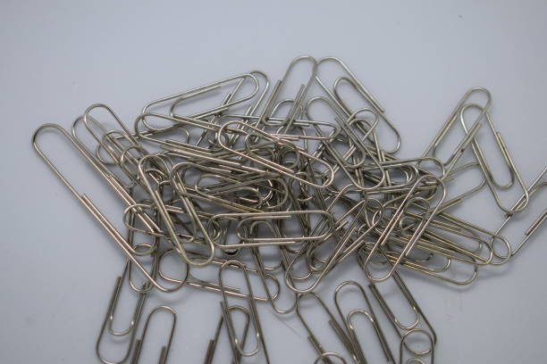 istock Silver color metal paper clips various sizes for office school personal document organizer 1338280171