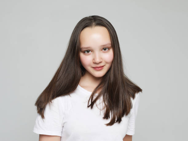 istock good looking young woman smiles positively 1338281121