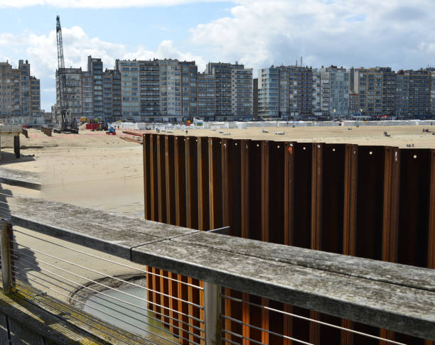 Blankenberge, West-Flanders, Belgium - August 29, 2021: sea steel wall surrounding in progress. Repairing the rotten columns .