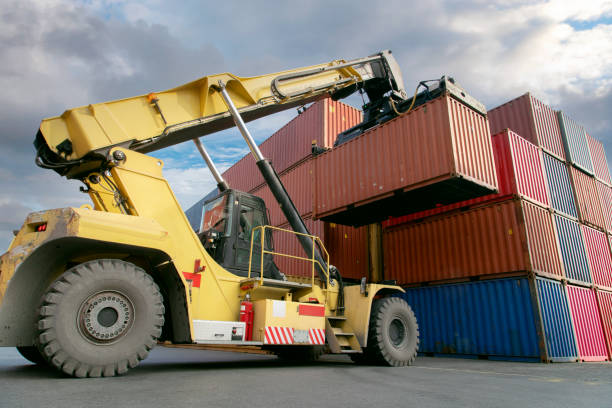 istock Crane lifting up container in commercial port. 1338284117