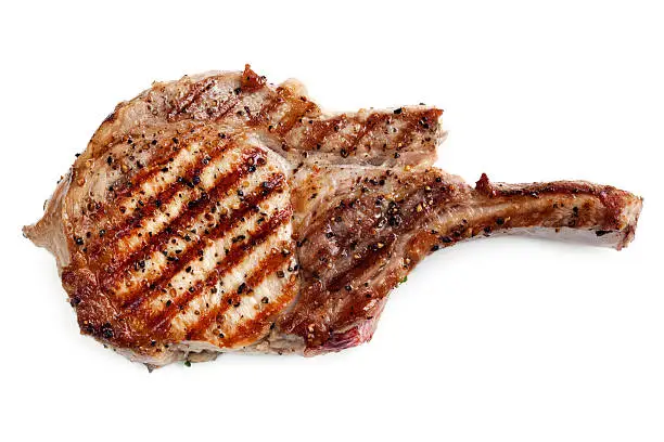 Grilled pork loin cutlet, isolated on white background.